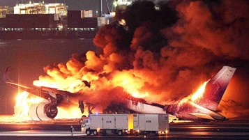 JAL Airplane in Flames at Haneda by Jiji Press AFP